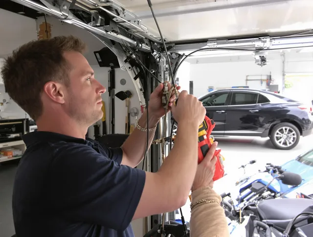 Guilford Garage Door Repair safety certified technician performing cable replacement in Guilford