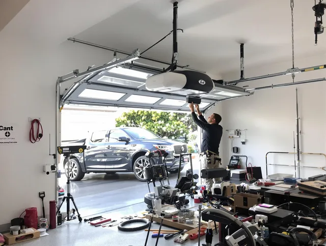 Guilford Garage Door Repair specialist installing smart garage door opener system in Guilford home