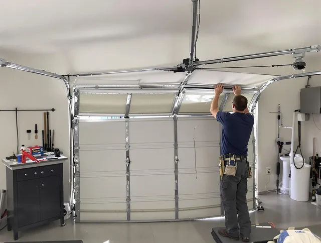 Guilford Garage Door Repair specialist performing precise section replacement on Guilford garage door
