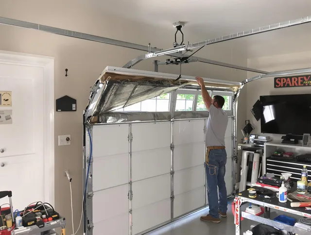 Garage door section replacement by Guilford Garage Door Repair in Guilford